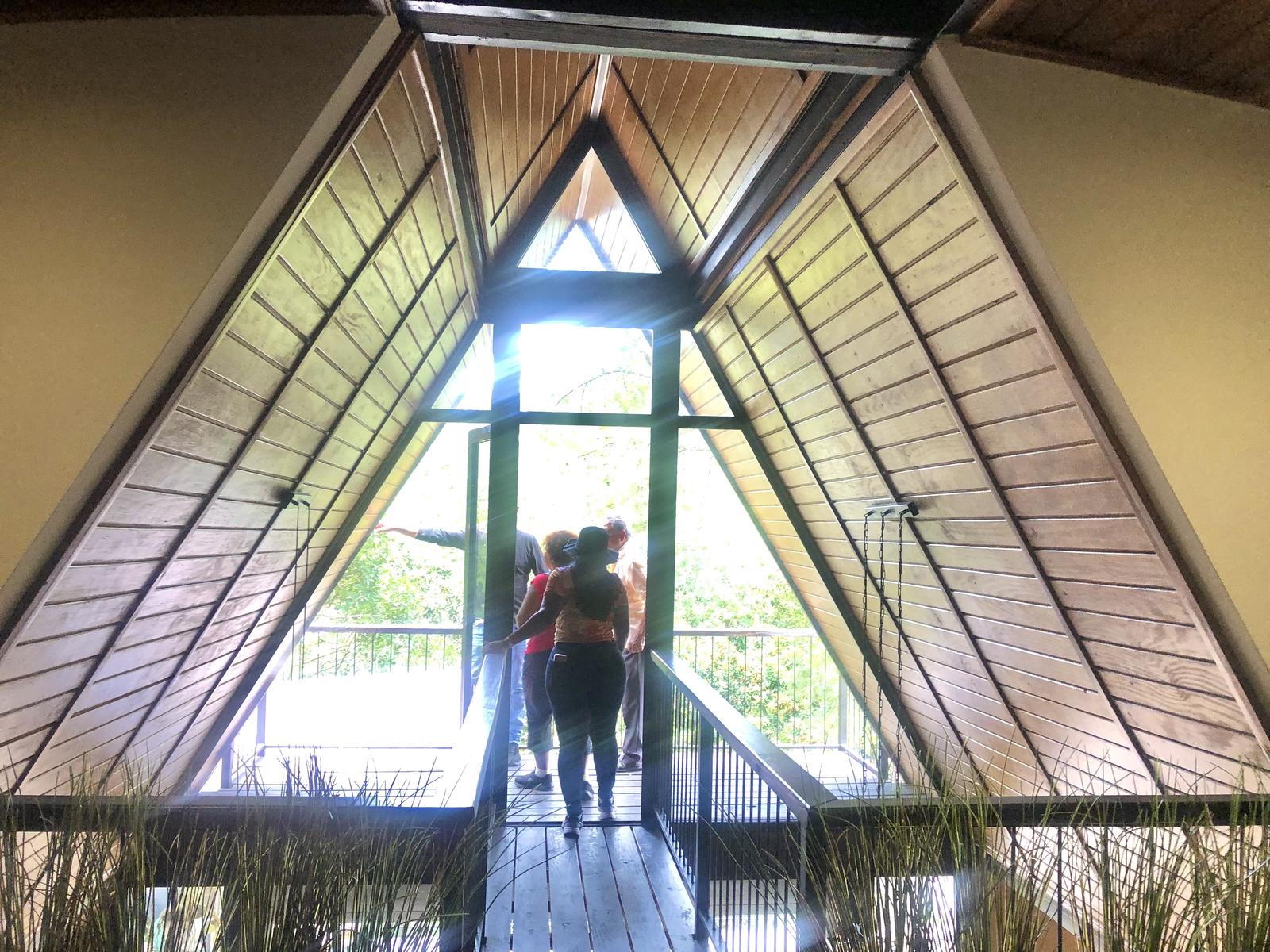 A-frame great room with wood ceiling and glass wall